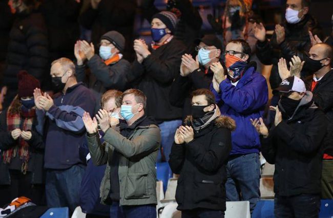 Face masks, no hugging for returning Premier League fans